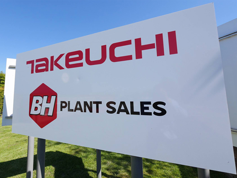 A sign with the takeuchi logo on and the BH plant sales logo below