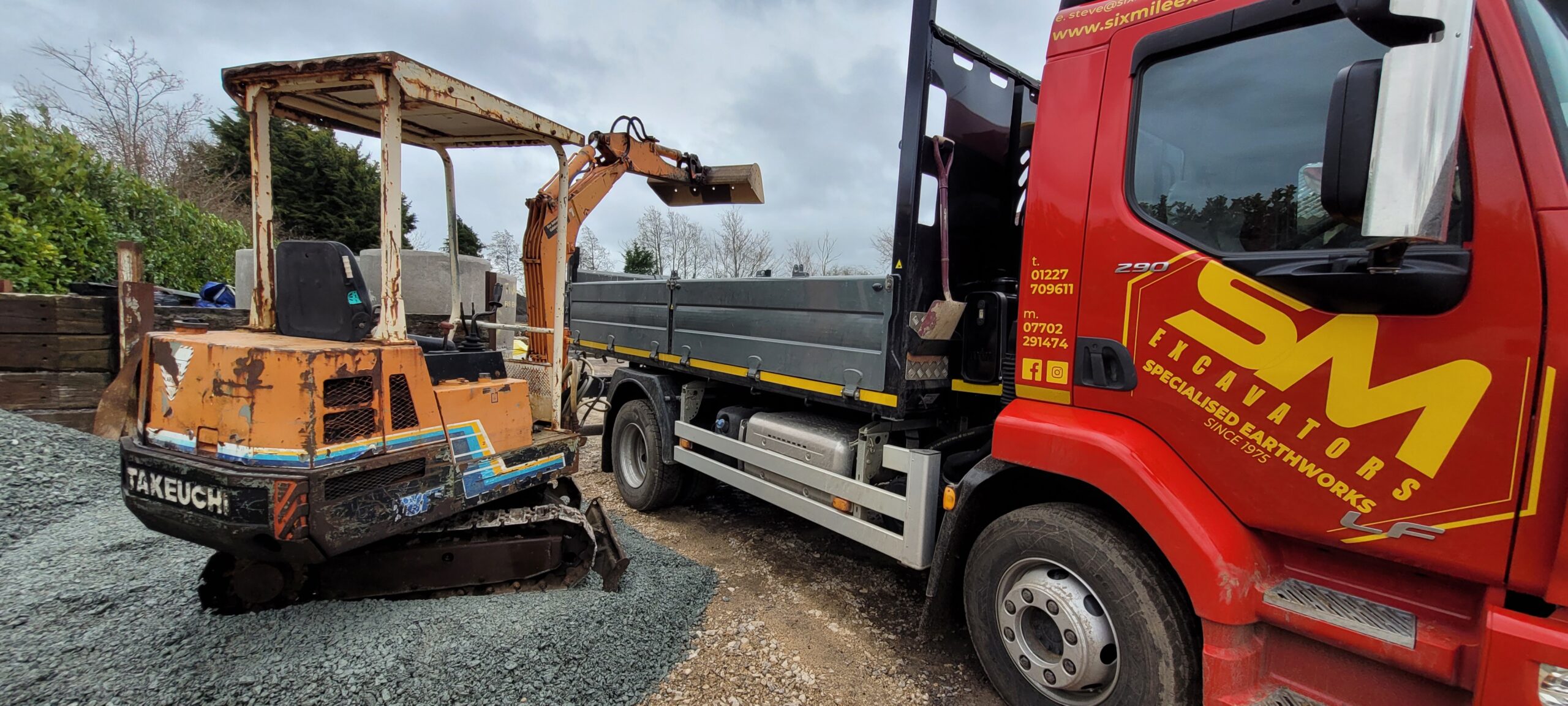 view from behind an old takeuchi digger canopy