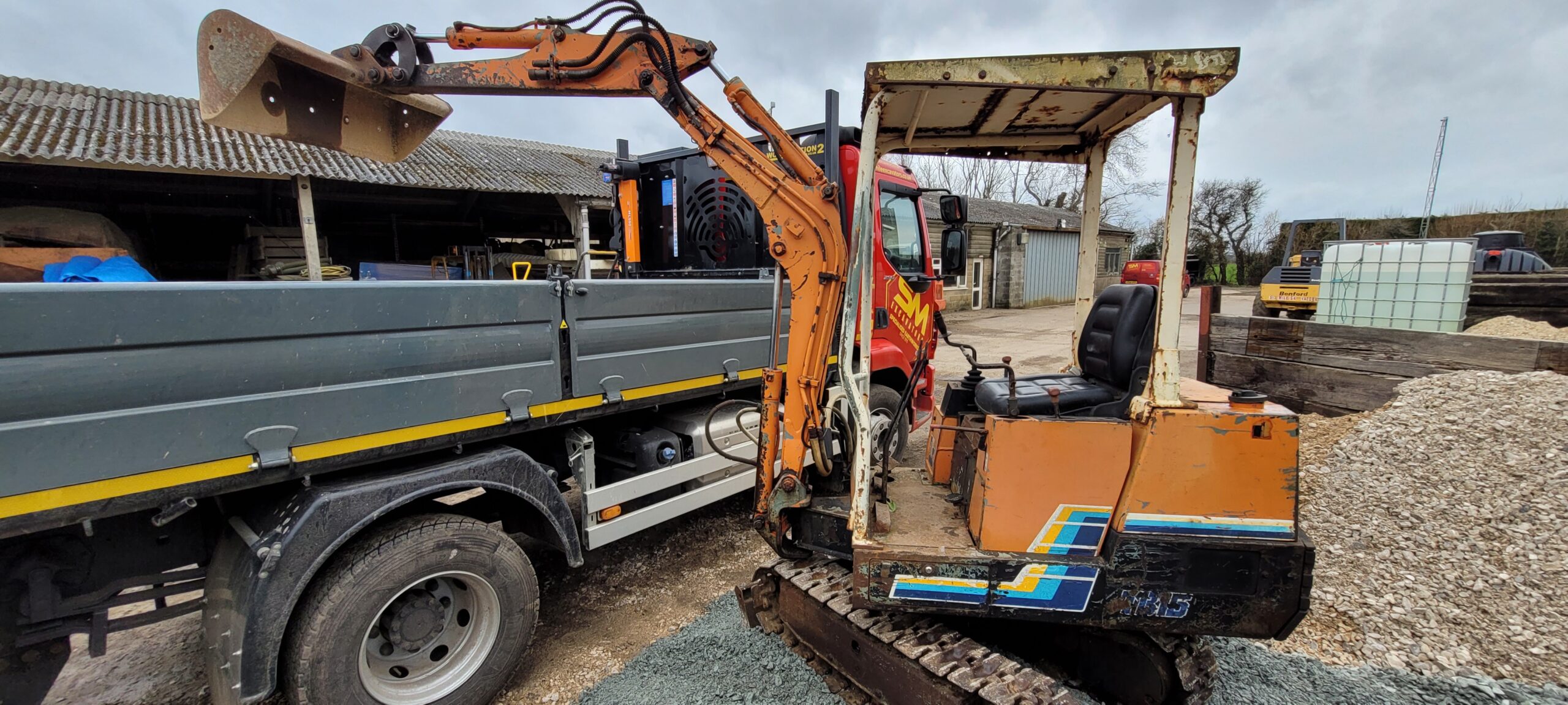 takeuchi digger painted orange boom up 