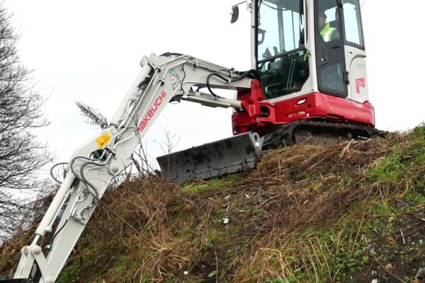 tb335r compact digger on a hill
