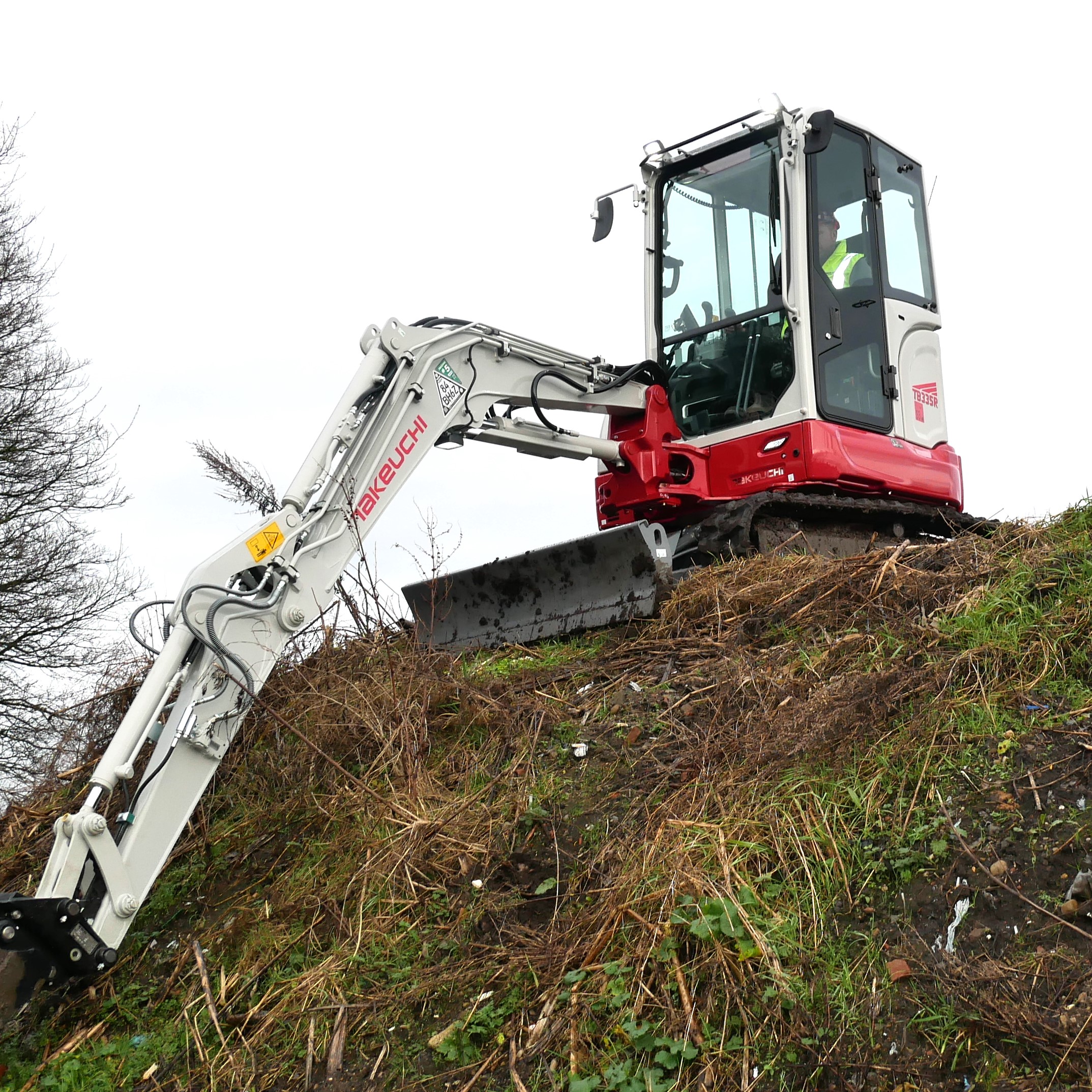 tb335r compact digger on a hill