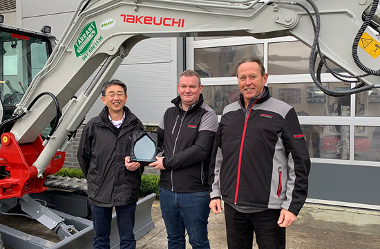 Conor at BFM collecting Takeuchi dealer award 2022