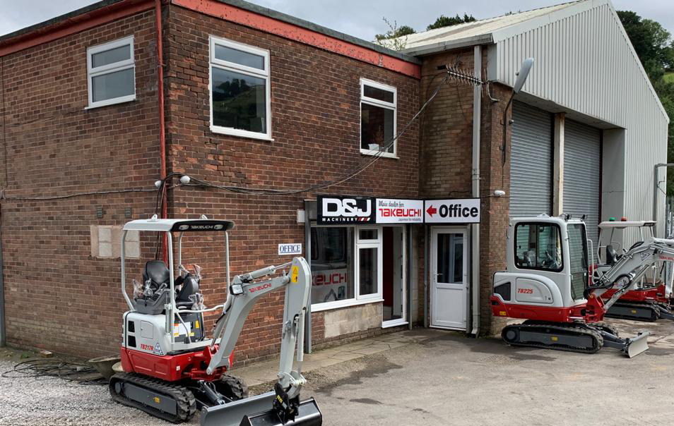 D&J Machinery building with a takeuchi canopy digger parked in front with another excavator in the background