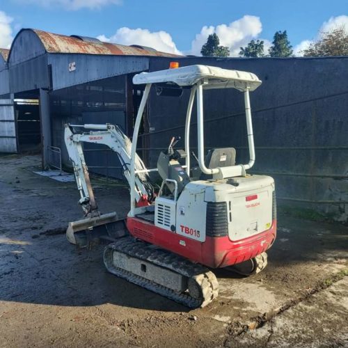 TB016 Takeuchi digger 2001 owned by Barry Daly in a builders yard