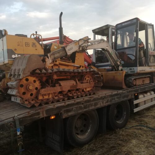 TB015 Takeuchi Digger on wagon with other vintage machines