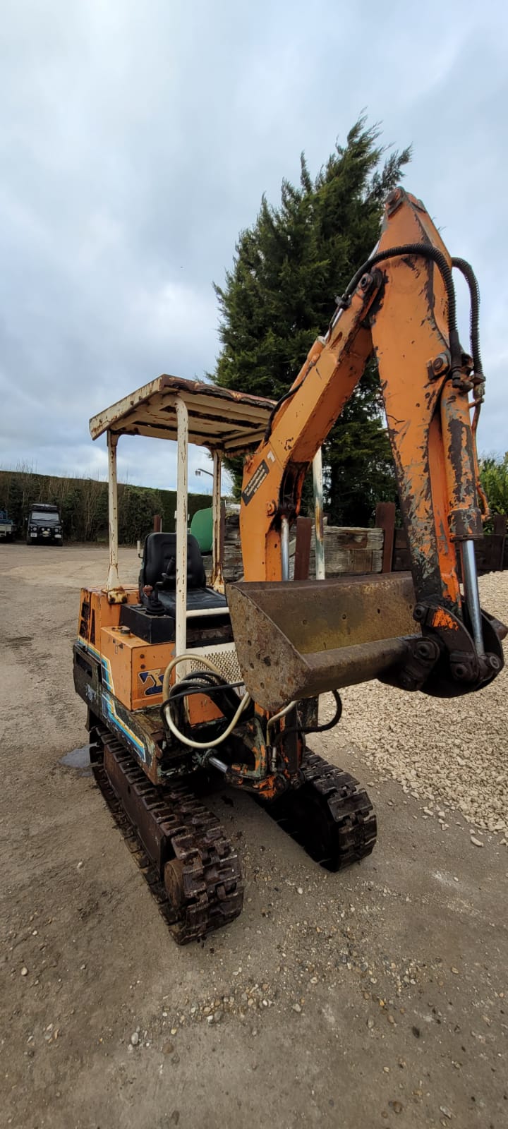 Orange Takeuchi Mini Excavator owned by six mile