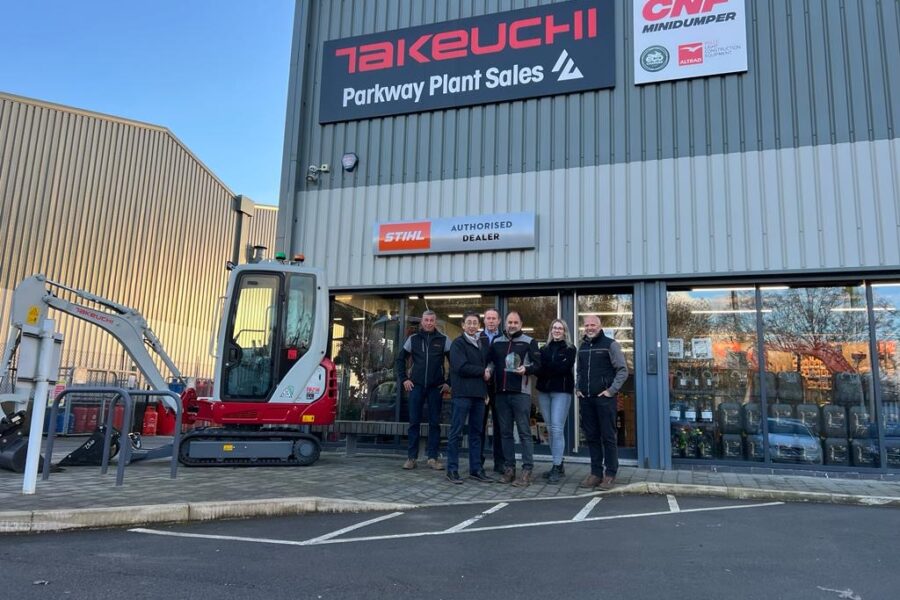 parkway plant team stood outside depot with takeuchi award