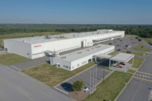 new takeuchi factory in usa white building with car park