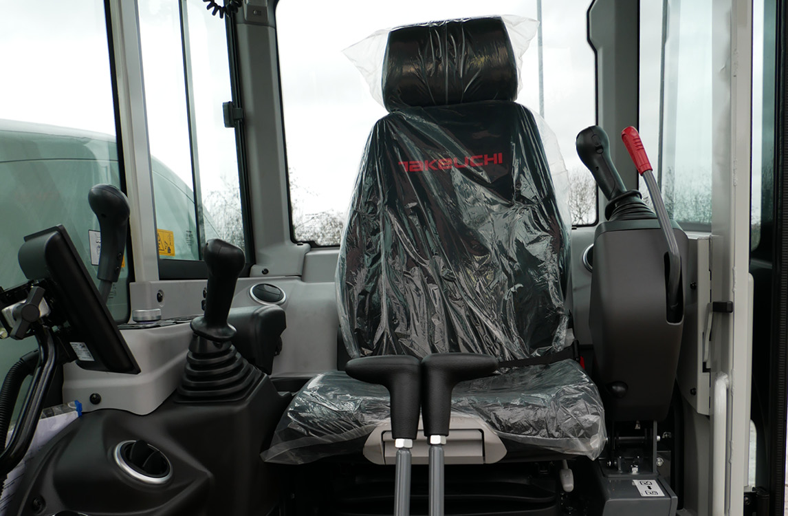 TB335R Compact Excavator with seat cover inside cabin
