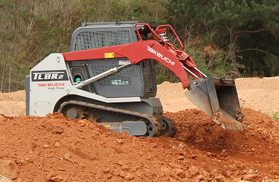 takeuchi tracked loader dumping soil