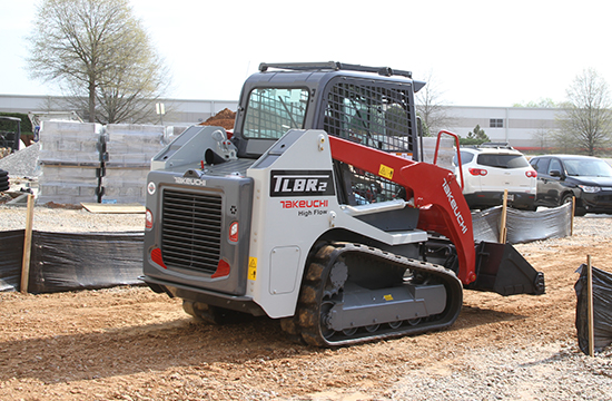 tl8r2 tracked loader driving away