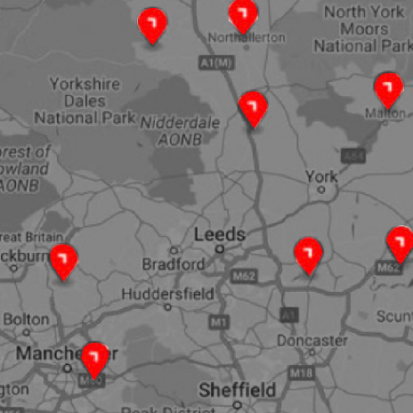 a black and white map of UK with locations shown in red being the takeuchi dealers for sales