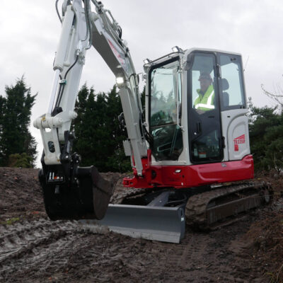 Takeuchi TB335R Compact Excavator operating on construction site7