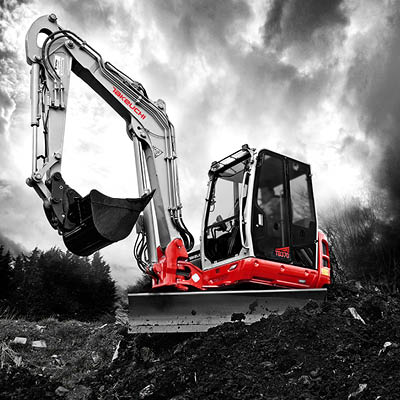 takeuchi TB370 7 tonne digger with sky behind in a black and white mode and the excavator in colour