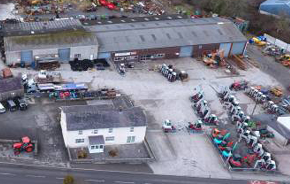 drone photo of J Davies & sons depot with lots of excavators and other various machines in the yard.