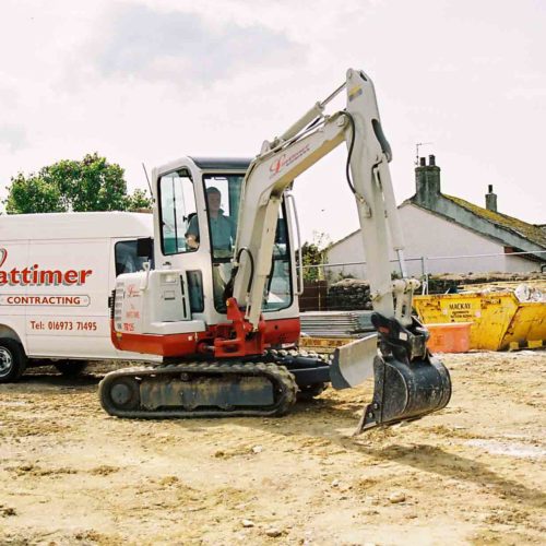 Takeuchi TB125 on a construction site in the UK