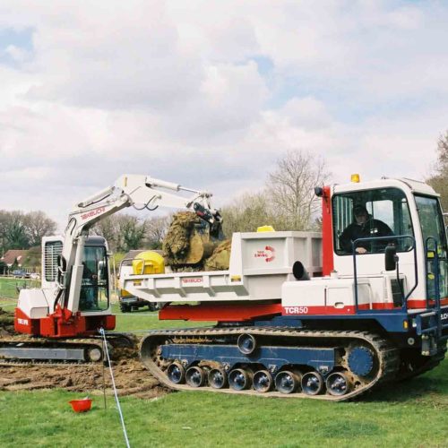 Takeuchi TCR50 TB53FR tipping into back of the dumper