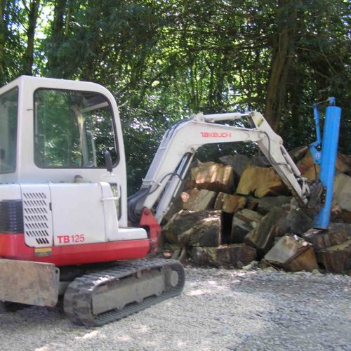 Takeuchi TB125 using new machinery to clear site