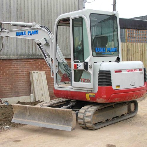 Takeuchi TB135 Digger with bucket down and parked for Eagle Plant