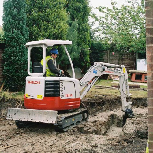 Takeuchi TB23R mini digger doing the groundworks for a house extension