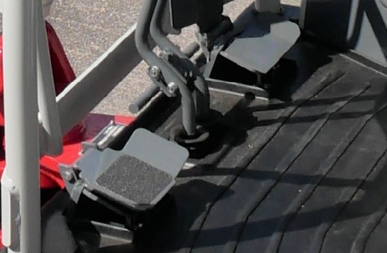 takeuchi tb217r inside photo of the foot pedals used to help control this micro excavator in the UK